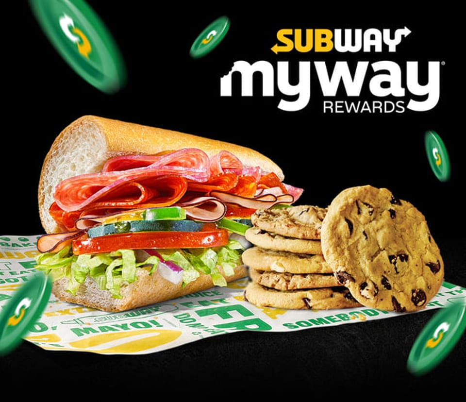 Subway sandwich with cookies on branded paper, with "Subway MyWay Rewards" text and green tokens.